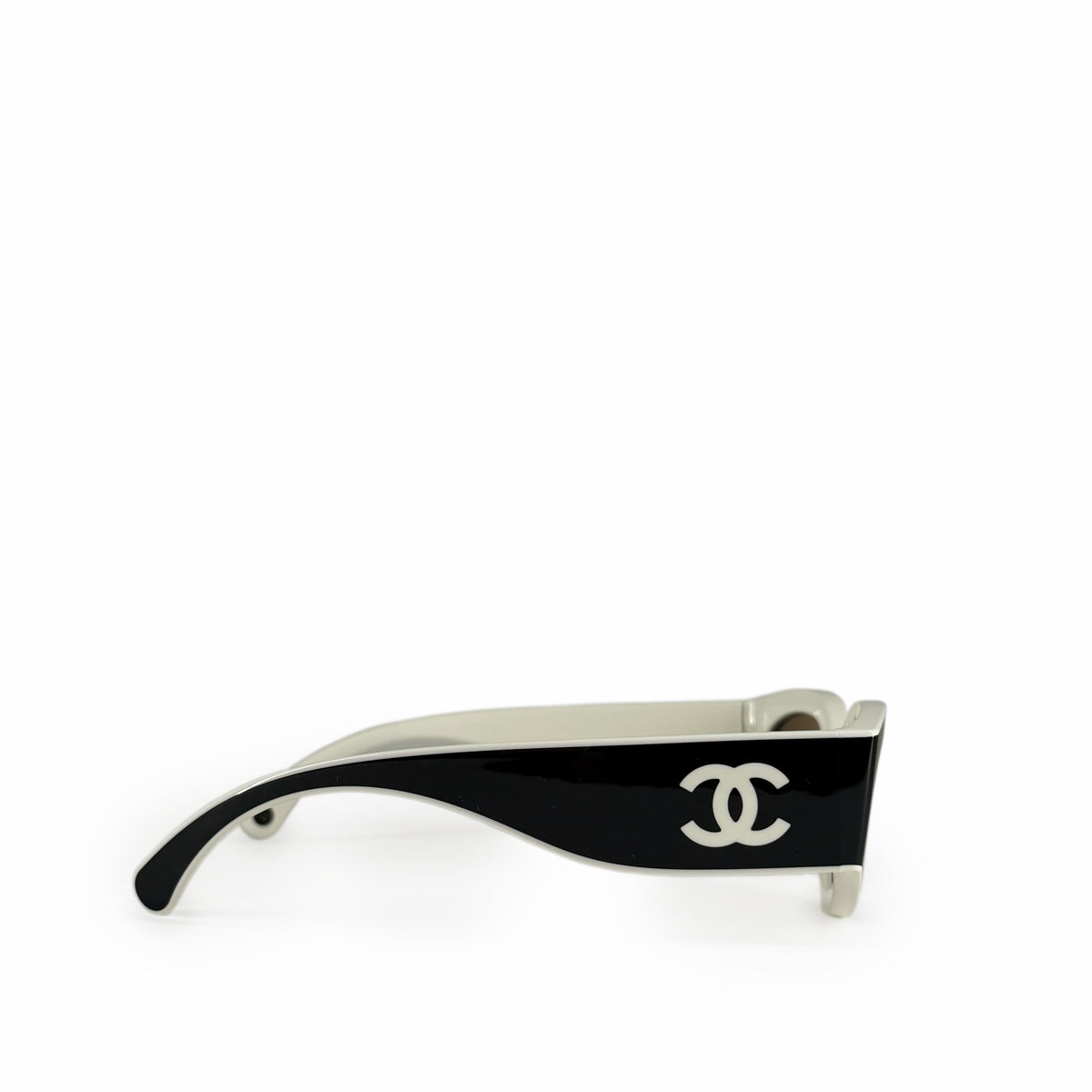 Black Chanel sunglasses with silver interlocking CC logo on the temple, curated Pre-loved Luxury by Myluxe in Helsinki.