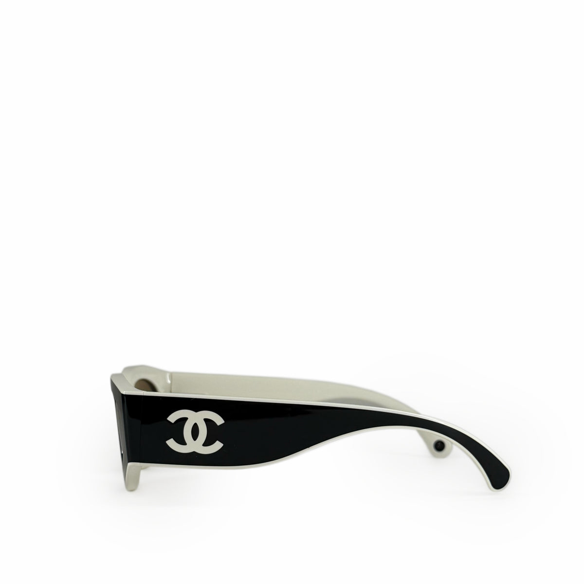Black Chanel sunglasses with silver interlocking C logo on the temple, curated Pre-loved Luxury by Myluxe in Helsinki.