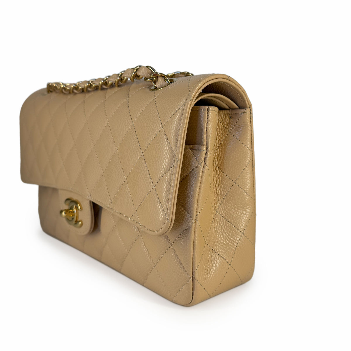 Beige quilted lambskin leather flap bag with gold chain strap, curated Pre-loved Luxury by Myluxe in Helsinki.