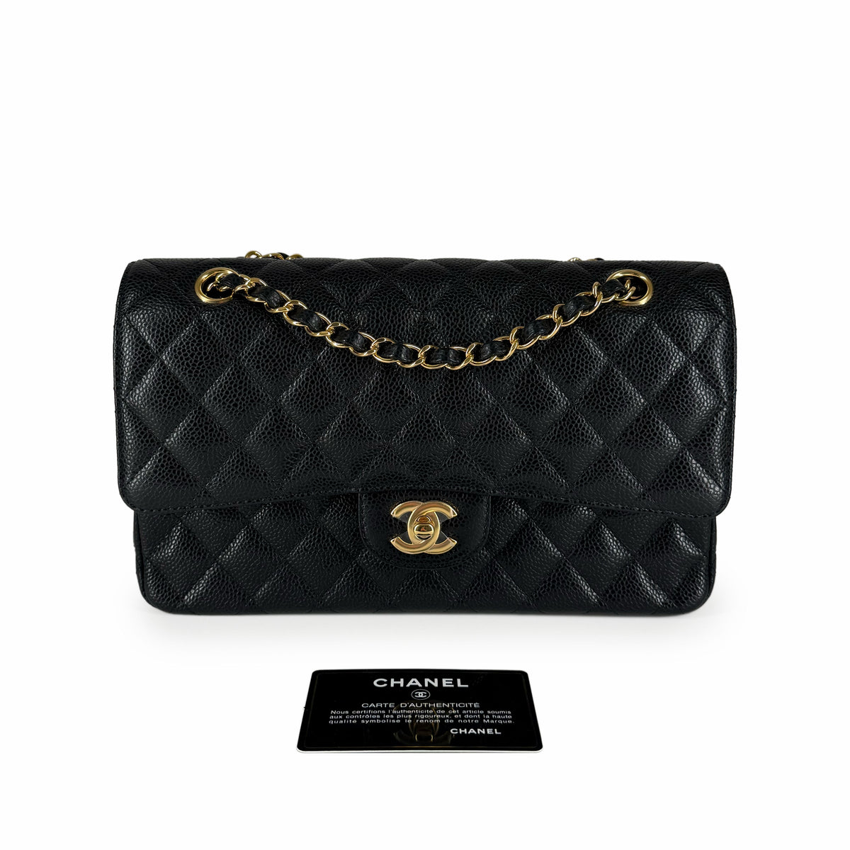Black quilted caviar leather Chanel flap bag with gold chain and CC logo, curated Pre-loved Luxury by Myluxe in Helsinki.
