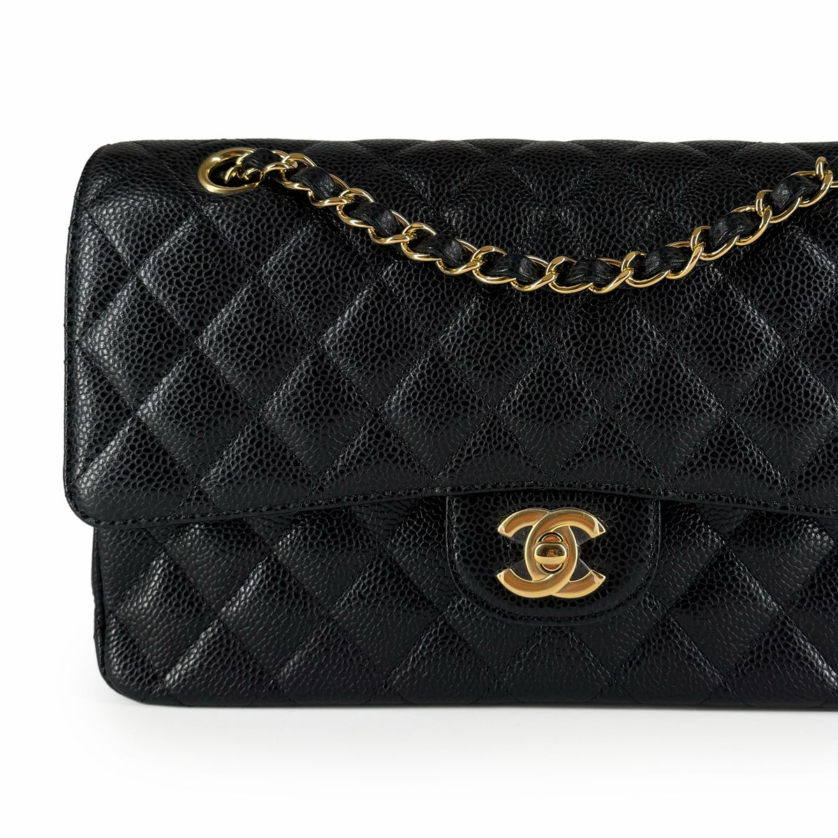 Black quilted caviar leather Chanel flap bag with gold-tone chain, curated Pre-loved Luxury by Myluxe in Helsinki.