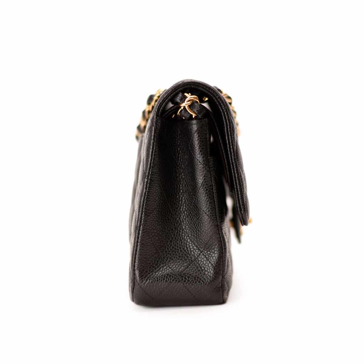Black quilted leather Chanel handbag with gold chain strap. curated Pre-loved Luxury by Myluxe in Helsinki.