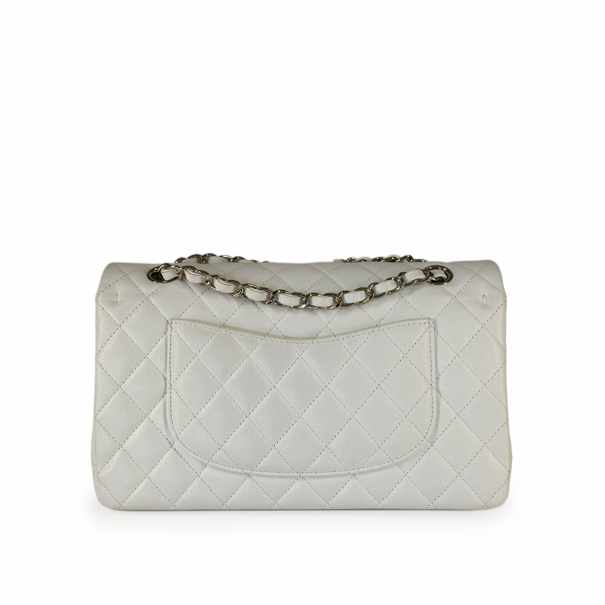 White quilted leather handbag with silver chain strap, curated Pre-loved Luxury by Myluxe in Helsinki.