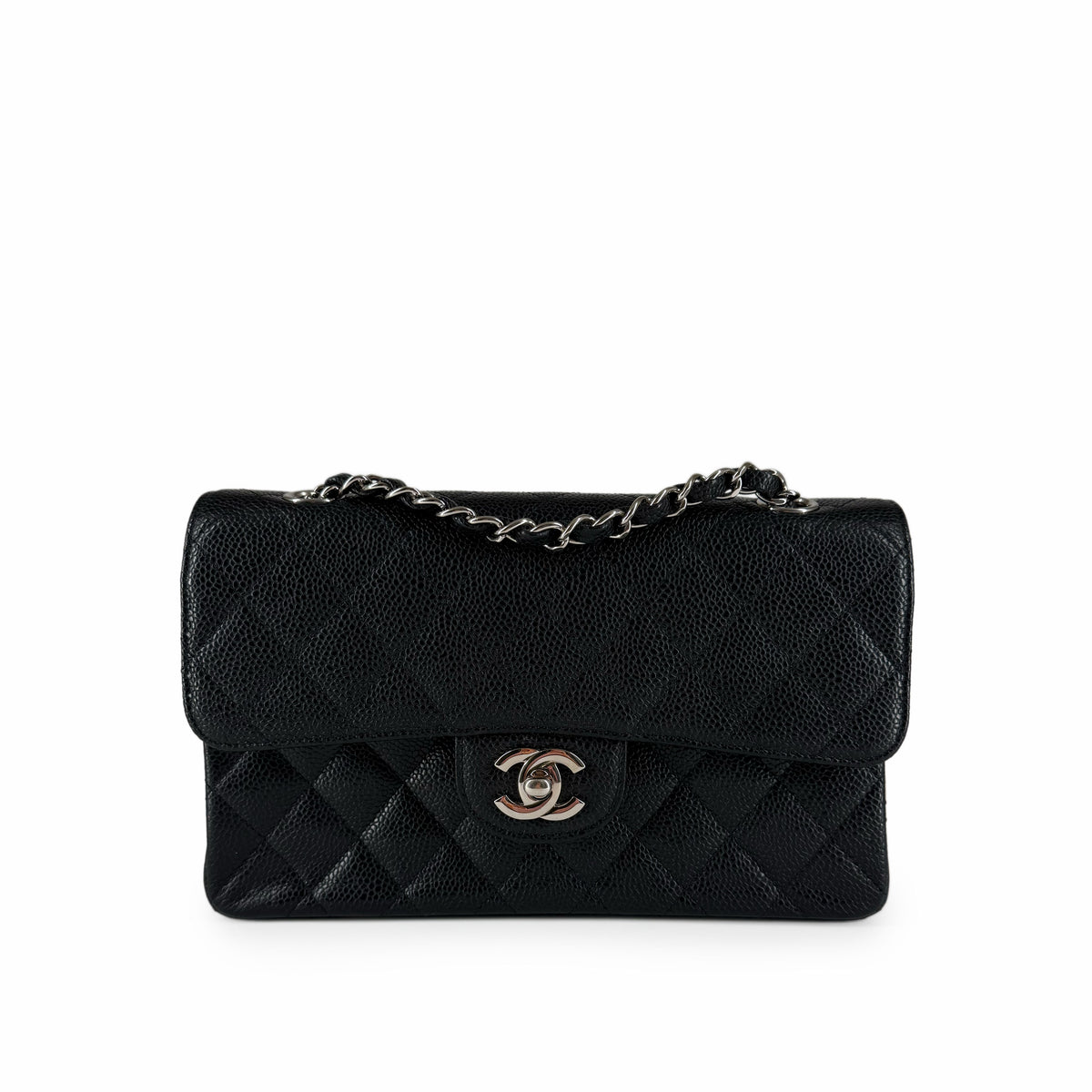 Black caviar leather Chanel flap bag with silver chain strap, curated Pre-loved Luxury by Myluxe in Helsinki.