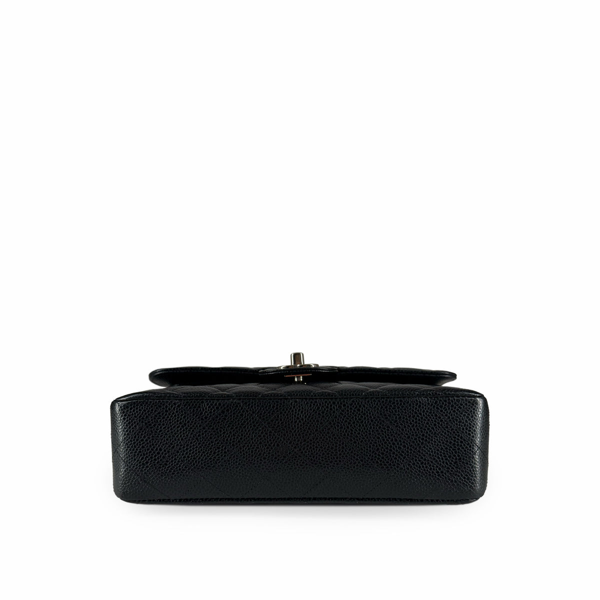 Black quilted caviar leather clutch with silver-tone metal clasp, curated Pre-loved Luxury by Myluxe in Helsinki.