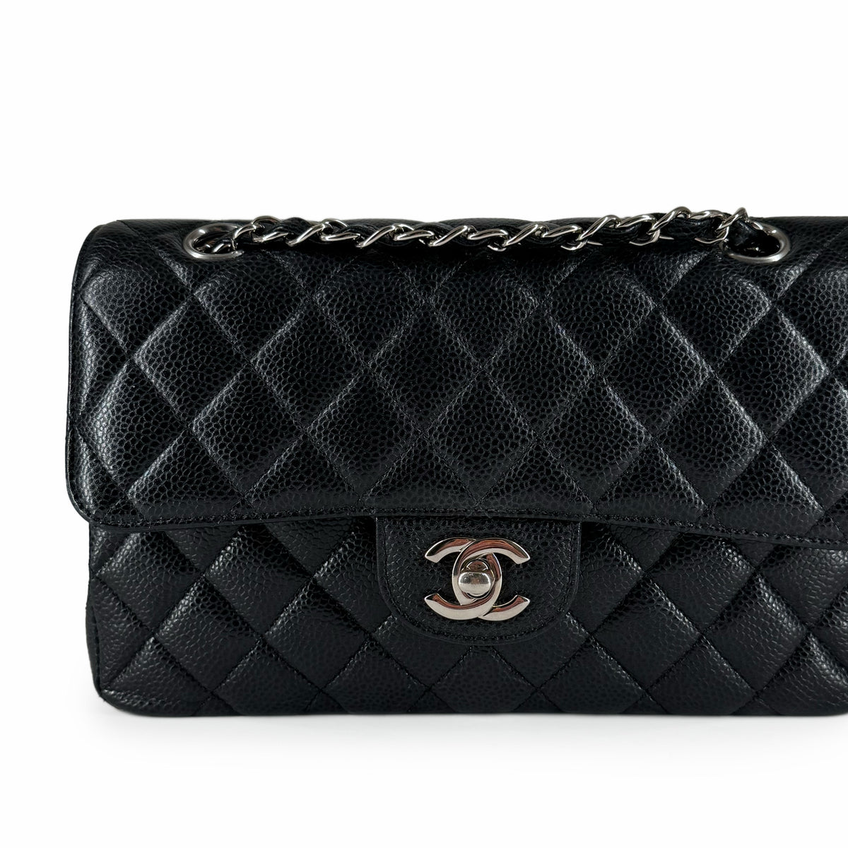 Black quilted caviar leather Chanel flap bag with silver hardware, curated Pre-loved Luxury by Myluxe in Helsinki.