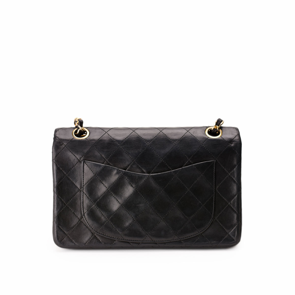 Black quilted leather Chanel handbag with gold-tone hardware, curated Pre-loved Luxury by Myluxe in Helsinki.