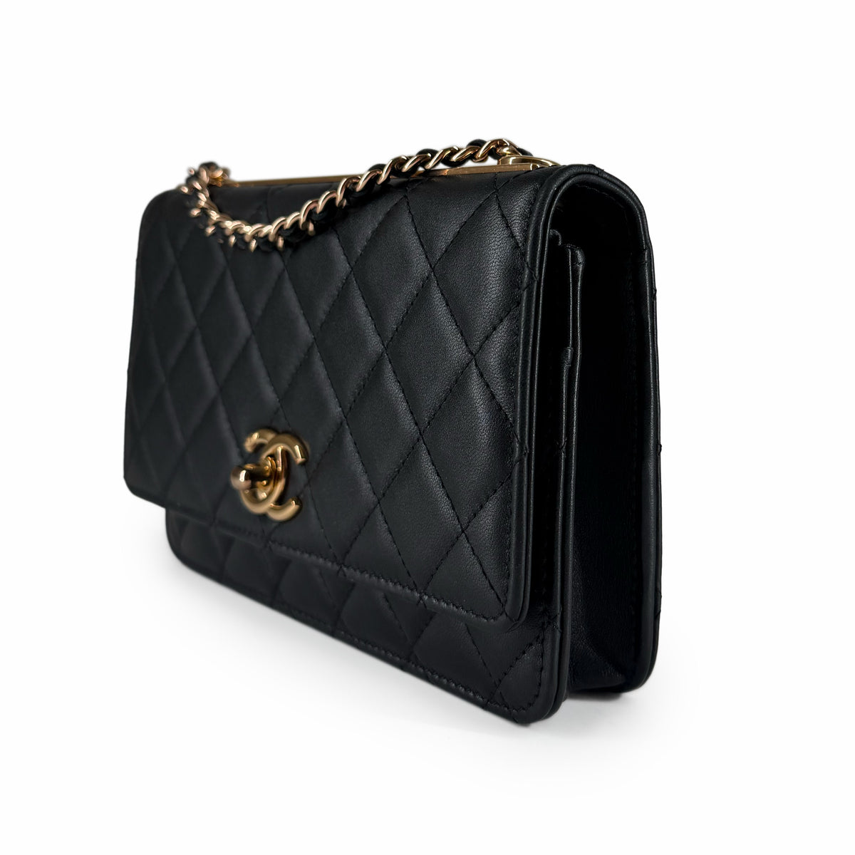 Black quilted lambskin Chanel flap bag with gold-tone hardware and chain strap, curated Pre-loved Luxury by Myluxe in Helsinki.