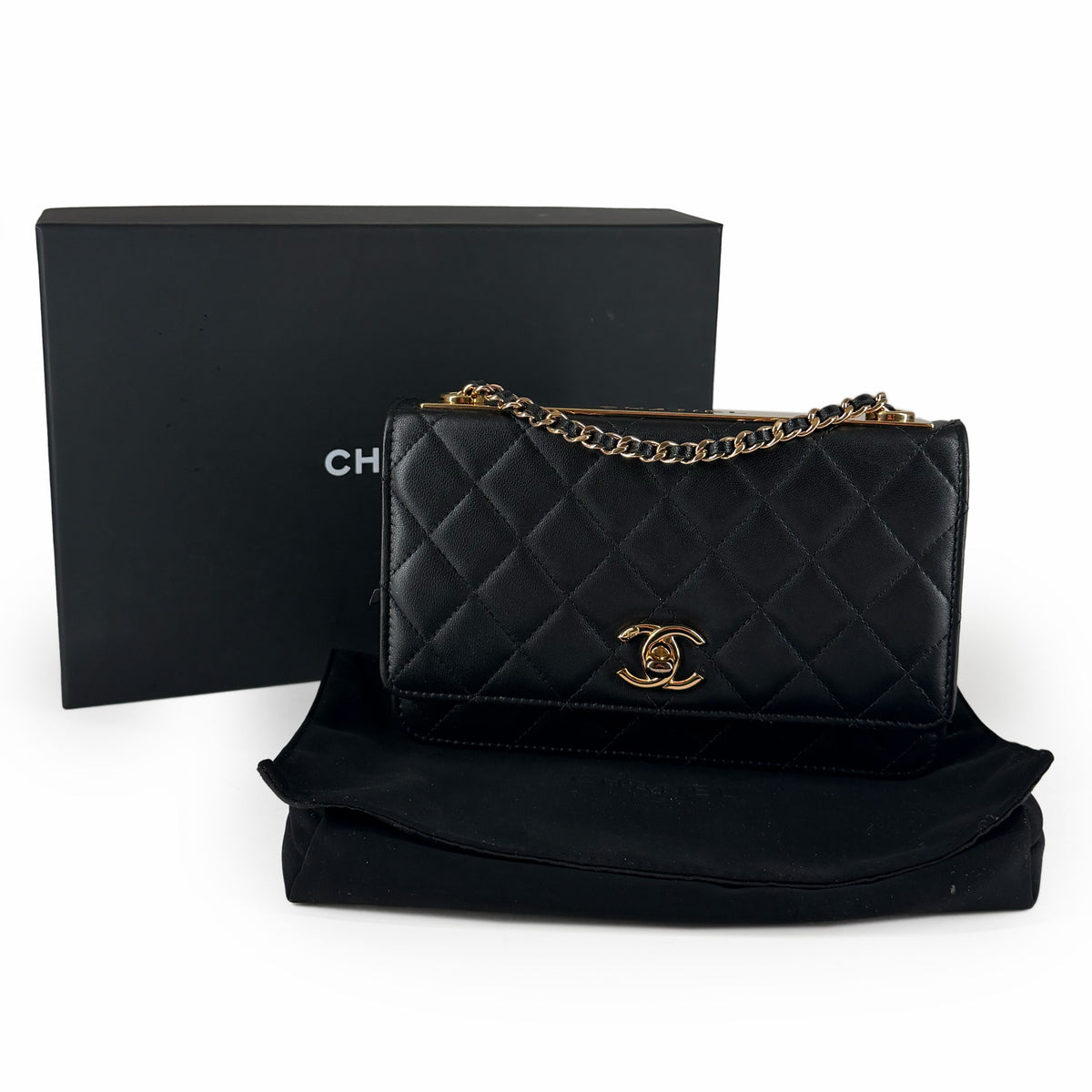 Black quilted lambskin Chanel wallet with gold-tone chain and CC logo, curated Pre-loved Luxury by Myluxe in Helsinki.
