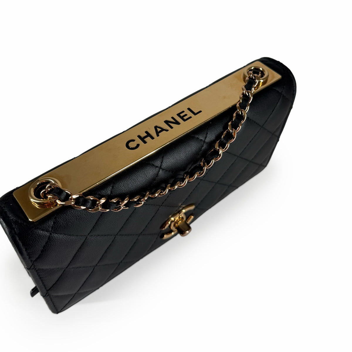 Black quilted leather Chanel handbag with gold-tone hardware and chain strap, curated Pre-loved Luxury by Myluxe in Helsinki.