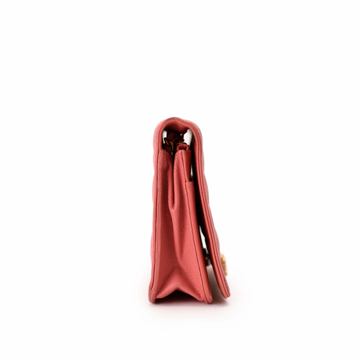 Side view of a rose pink leather designer wallet, curated Pre-loved Luxury by Myluxe in Helsinki.