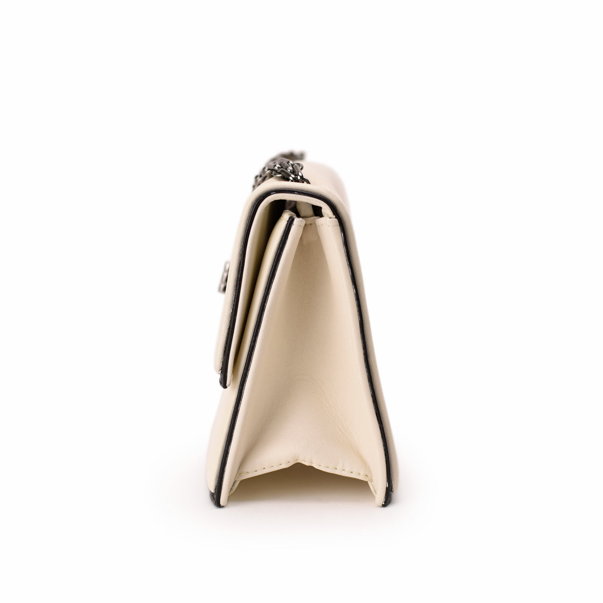 Cream leather Chanel flap bag with silver chain strap. curated Pre-loved Luxury by Myluxe in Helsinki.