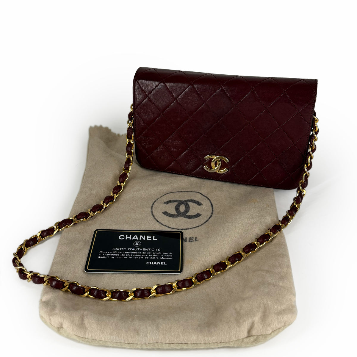 Burgundy quilted lambskin Chanel flap bag with gold-tone chain, curated Pre-loved Luxury by Myluxe in Helsinki.