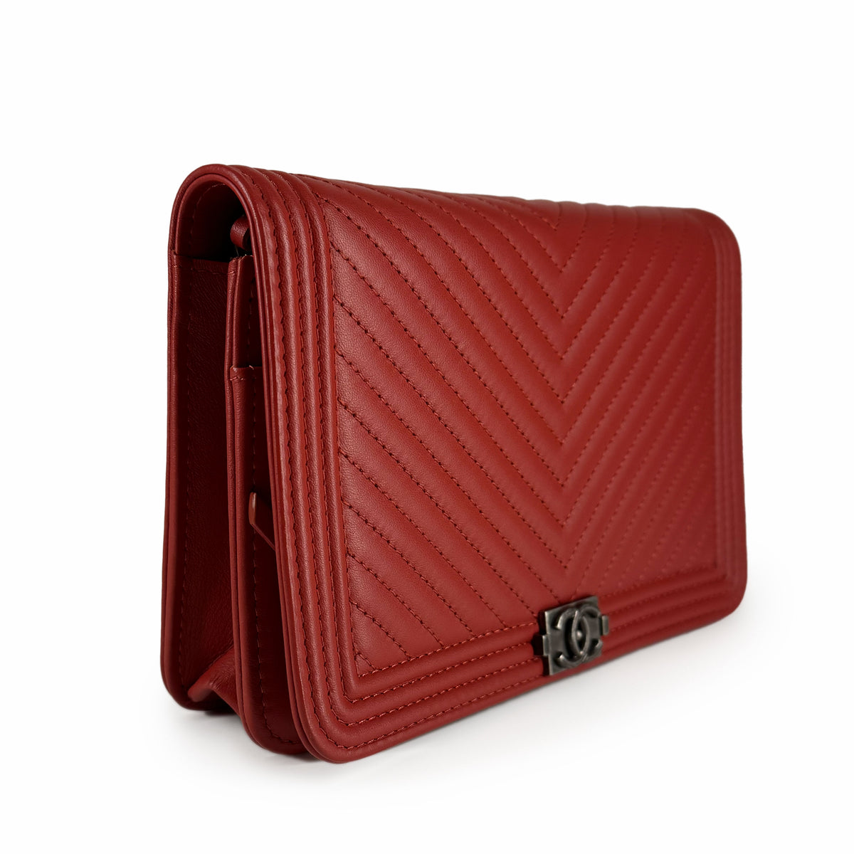 Red quilted leather flap handbag with chevron stitching and silver CC logo, curated Pre-loved Luxury by Myluxe in Helsinki.