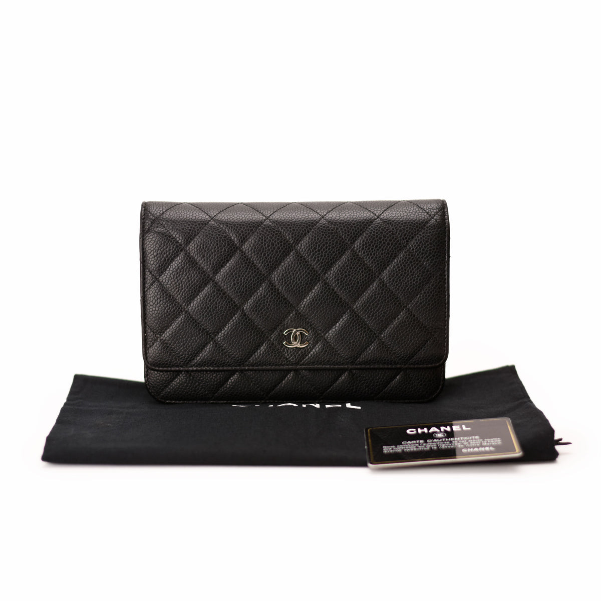 Black quilted caviar leather Chanel wallet with gold hardware. curated Pre-loved Luxury by Myluxe in Helsinki.