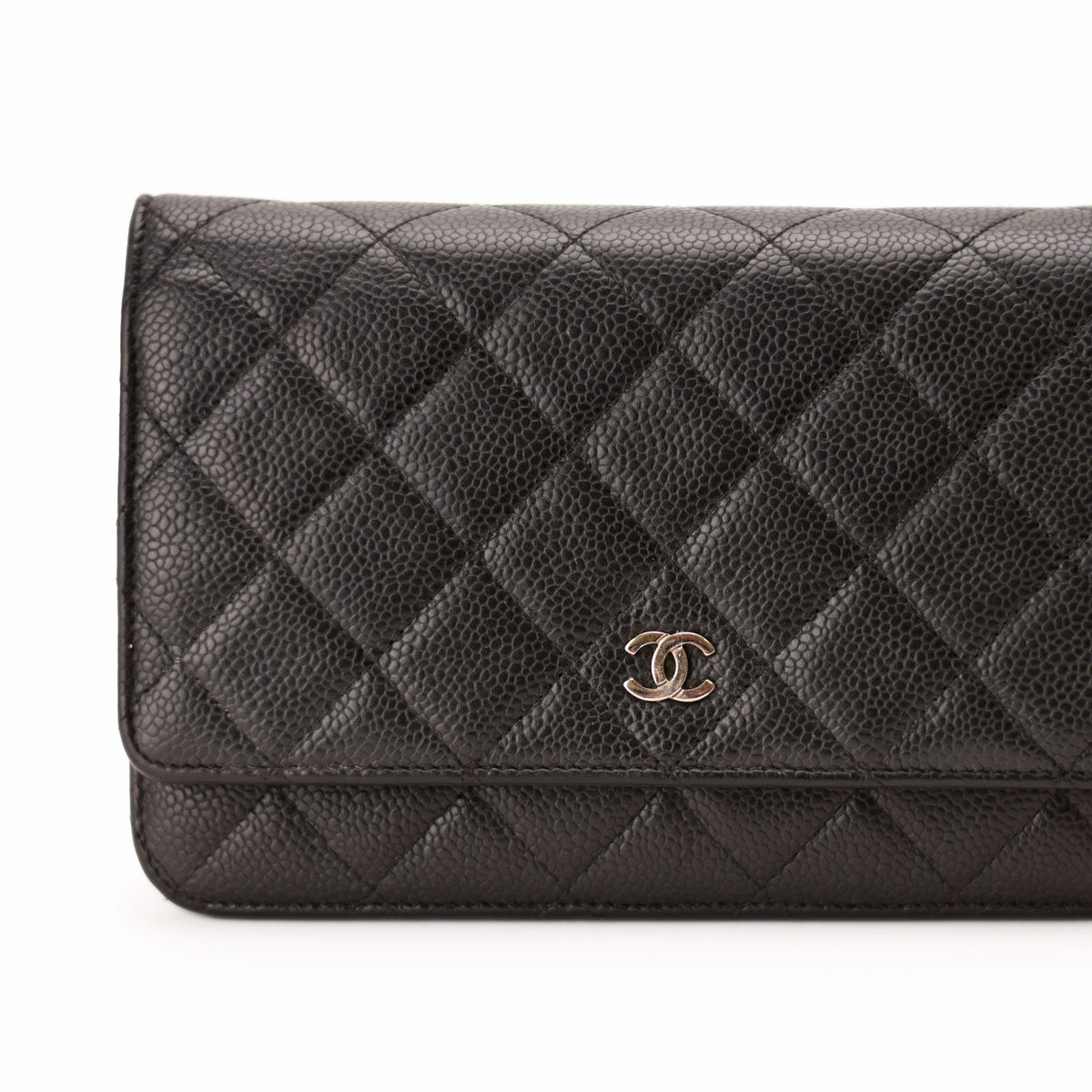 Black quilted caviar leather Chanel wallet with gold-tone CC logo. curated Pre-loved Luxury by Myluxe in Helsinki.