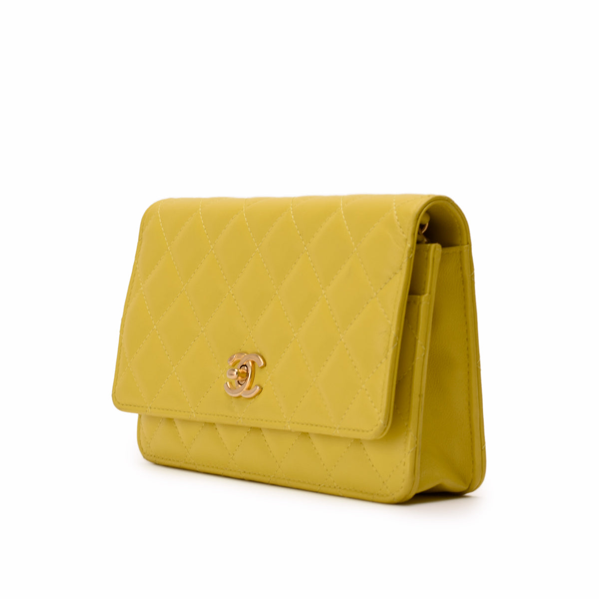 Yellow quilted leather Chanel flap bag with gold CC logo, curated Pre-loved Luxury by Myluxe in Helsinki.