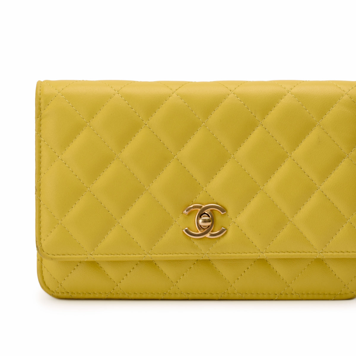 Yellow quilted lambskin Chanel wallet with gold-tone CC hardware, curated Pre-loved Luxury by Myluxe in Helsinki.