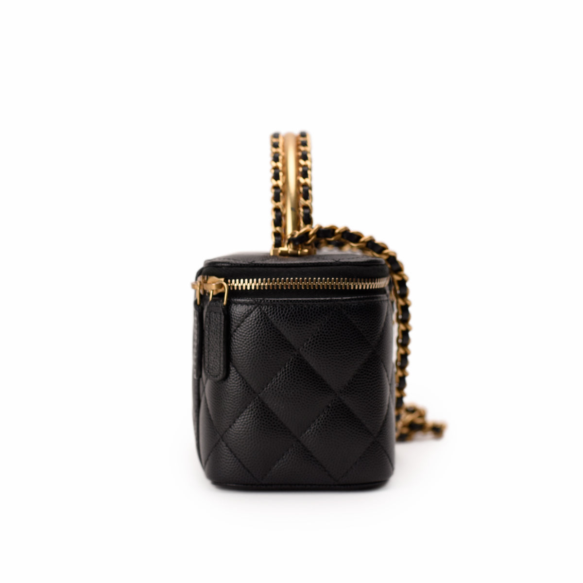 Black quilted leather Chanel vanity case with gold-tone chain strap, curated Pre-loved Luxury by Myluxe in Helsinki.