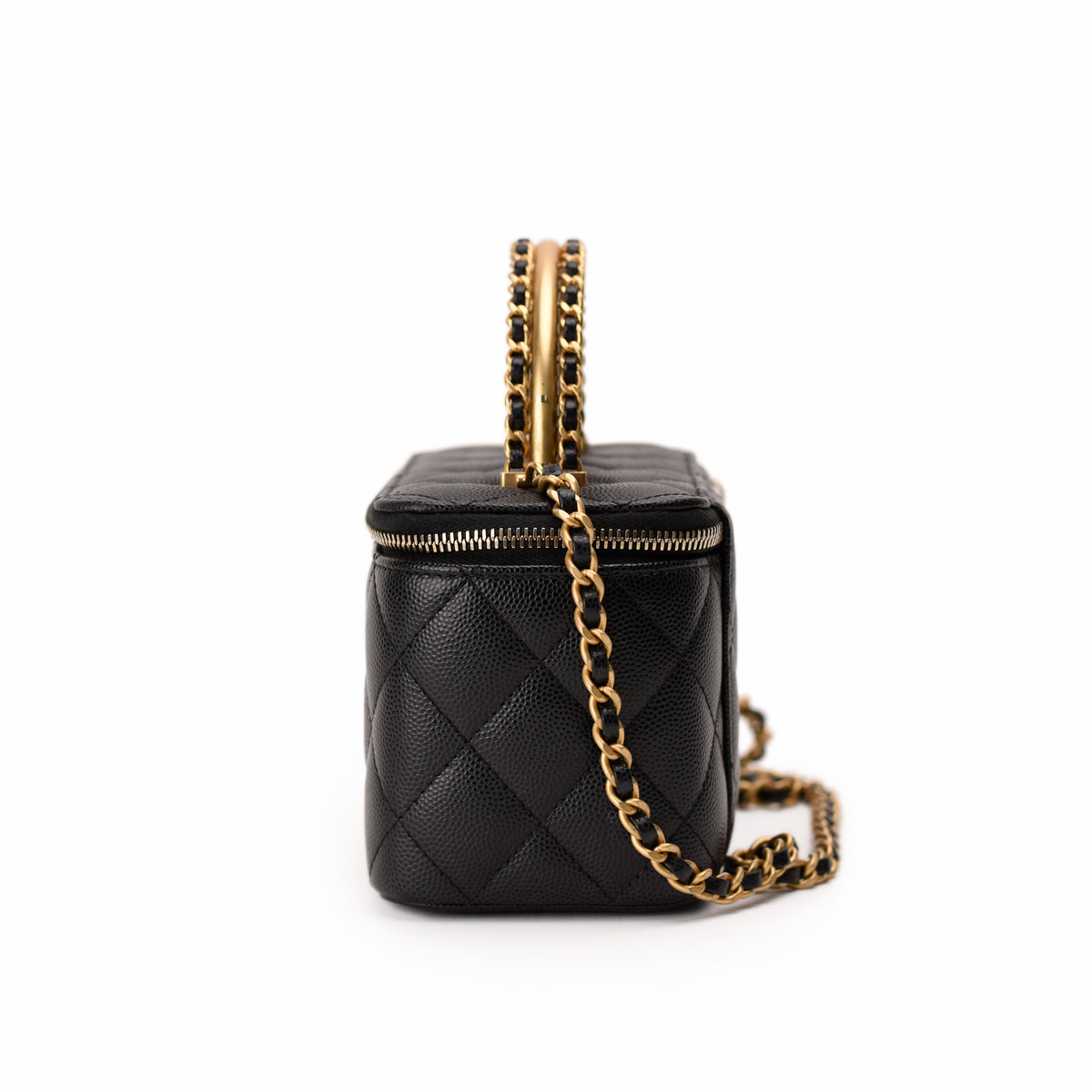 Black quilted leather Chanel vanity bag with gold-tone chain strap. curated Pre-loved Luxury by Myluxe in Helsinki.
