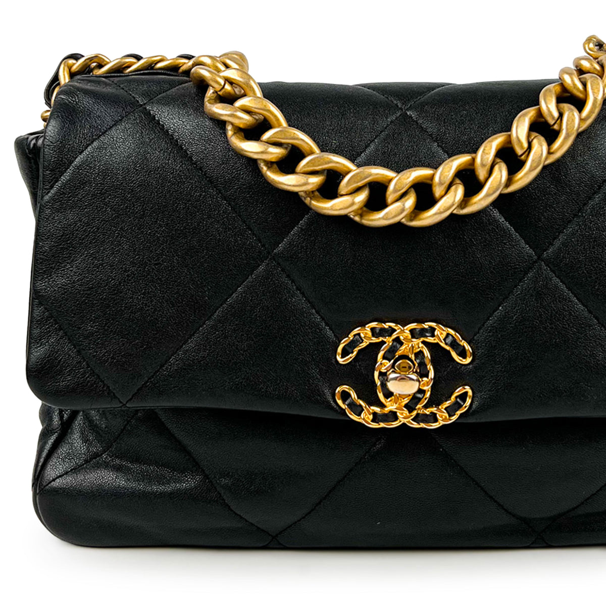 Black quilted lambskin Chanel handbag with gold-tone chain strap, curated Pre-loved Luxury by Myluxe in Helsinki.