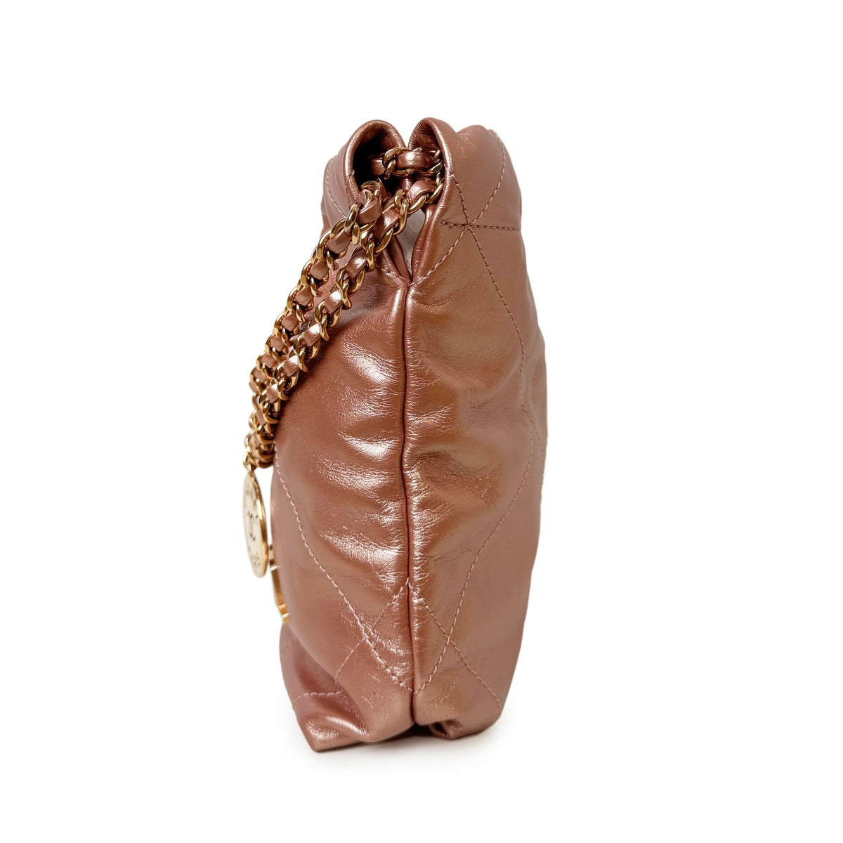 Rose gold metallic quilted leather handbag with gold chain strap, curated Pre-loved Luxury by Myluxe in Helsinki.