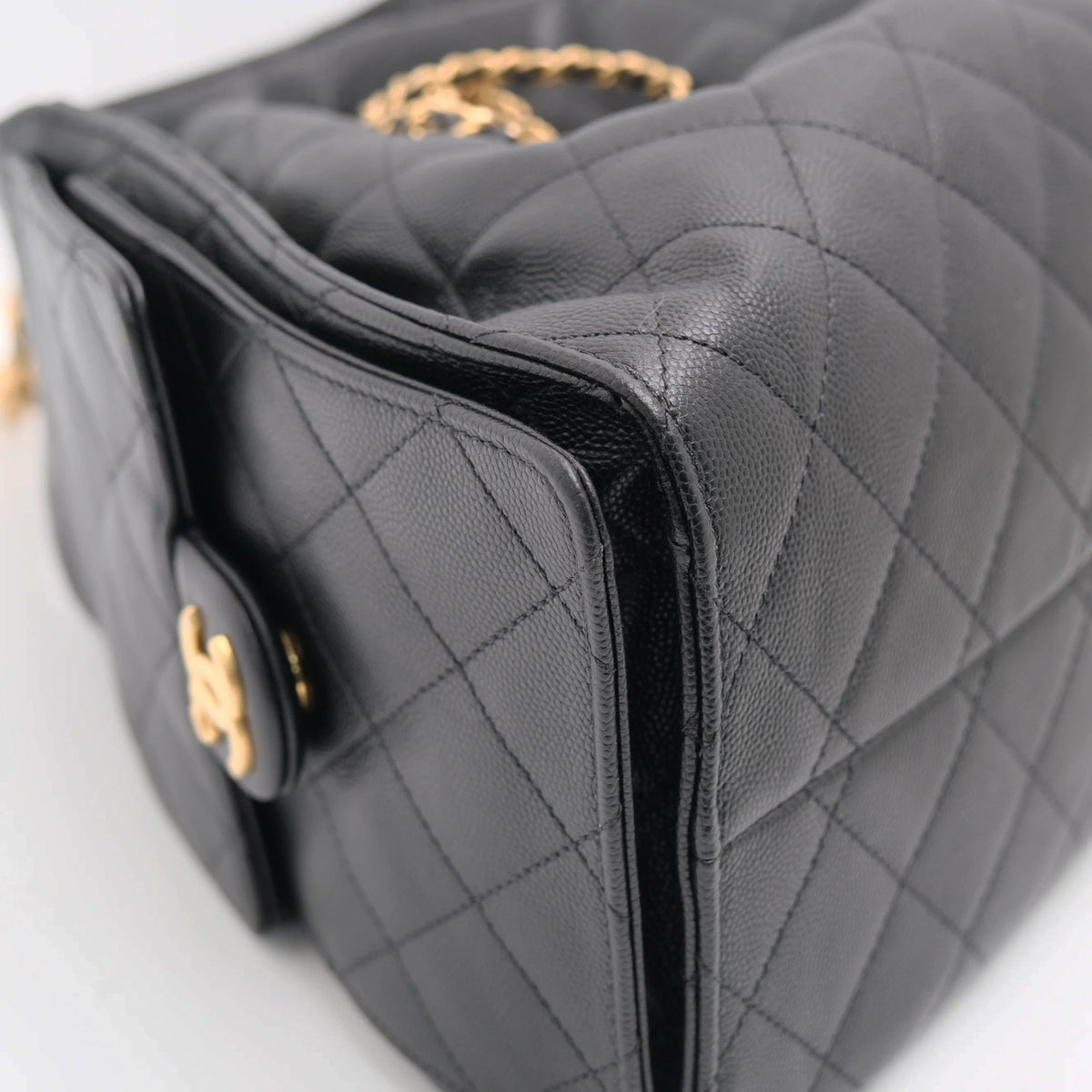 Black quilted caviar leather Chanel handbag with gold hardware. curated Pre-loved Luxury by Myluxe in Helsinki.