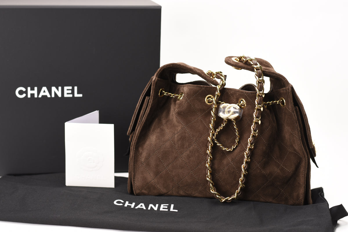 Chanel 25 small bag in brown suede with gold hardware, curated Pre-loved Luxury by Myluxe in Helsinki.