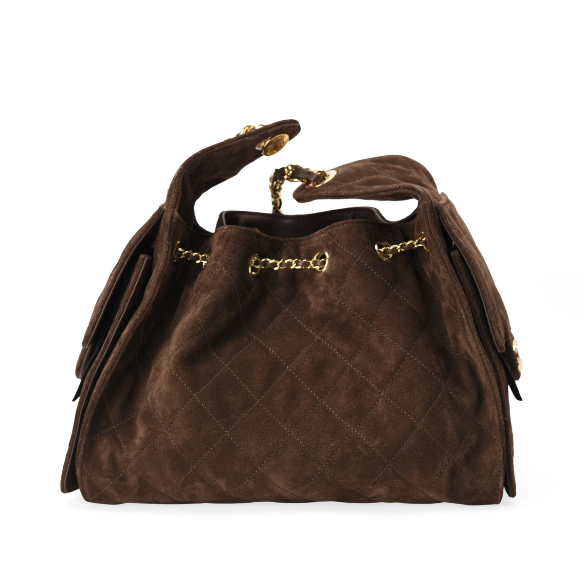 Chanel 25 small bag in brown quilted suede with gold hardware. curated Pre-loved Luxury by Myluxe in Helsinki.