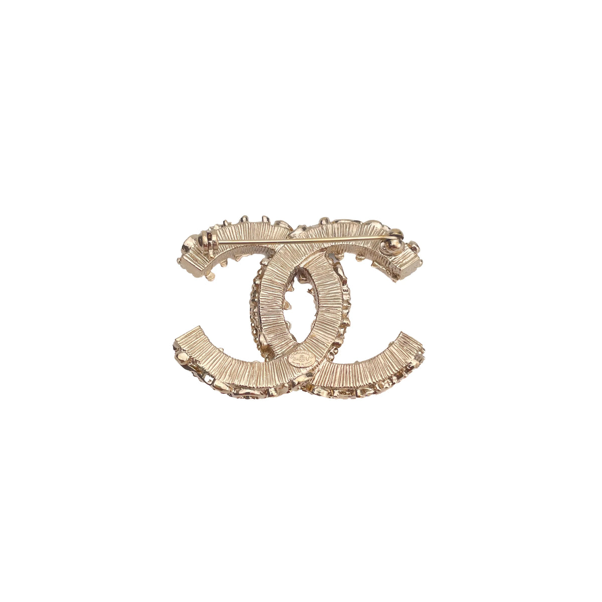 Gold-tone Chanel interlocking CC logo brooch with crystal embellishments, curated Pre-loved Luxury by Myluxe in Helsinki.