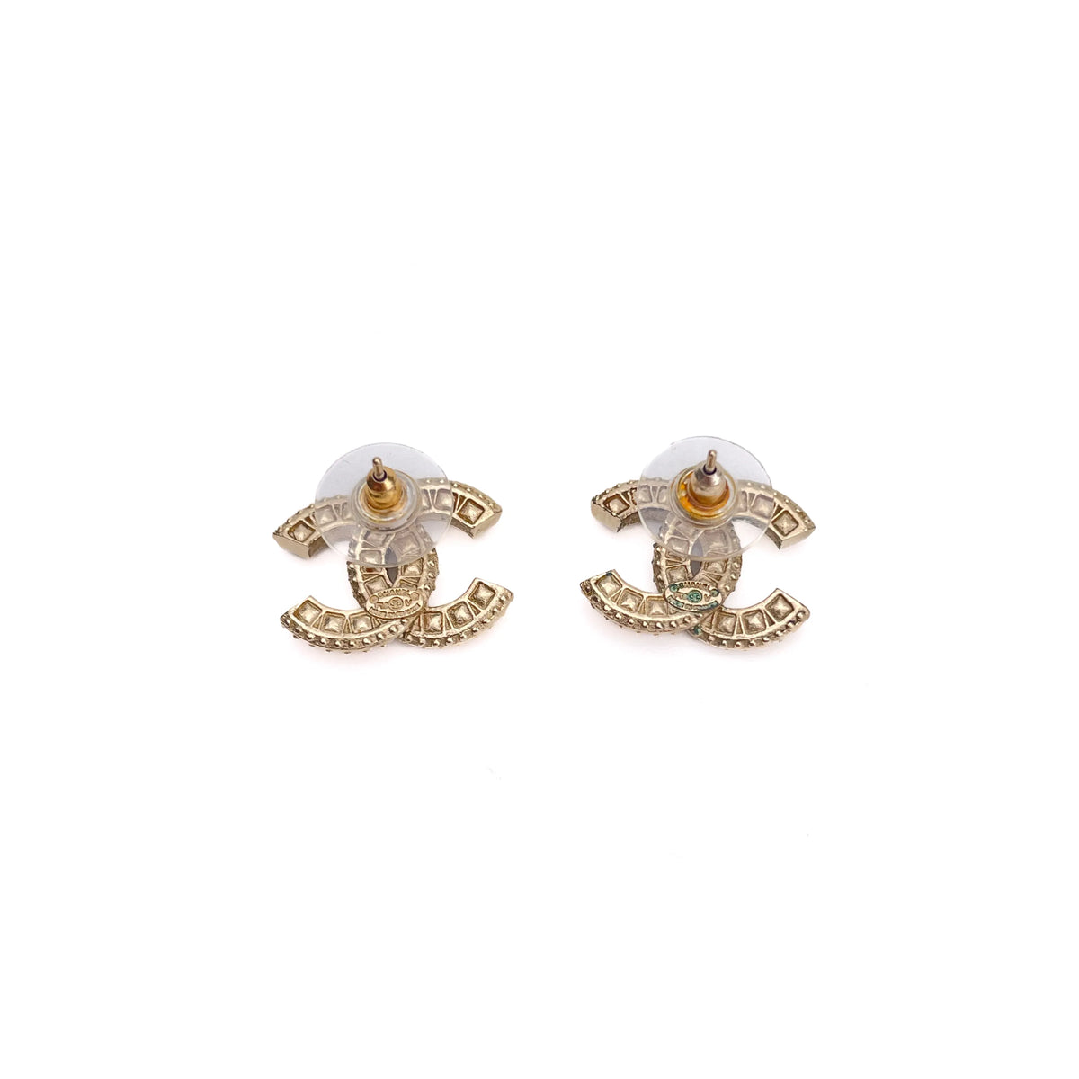 Gold-tone Chanel interlocking CC stud earrings with crystal embellishments, curated Pre-loved Luxury by Myluxe in Helsinki.