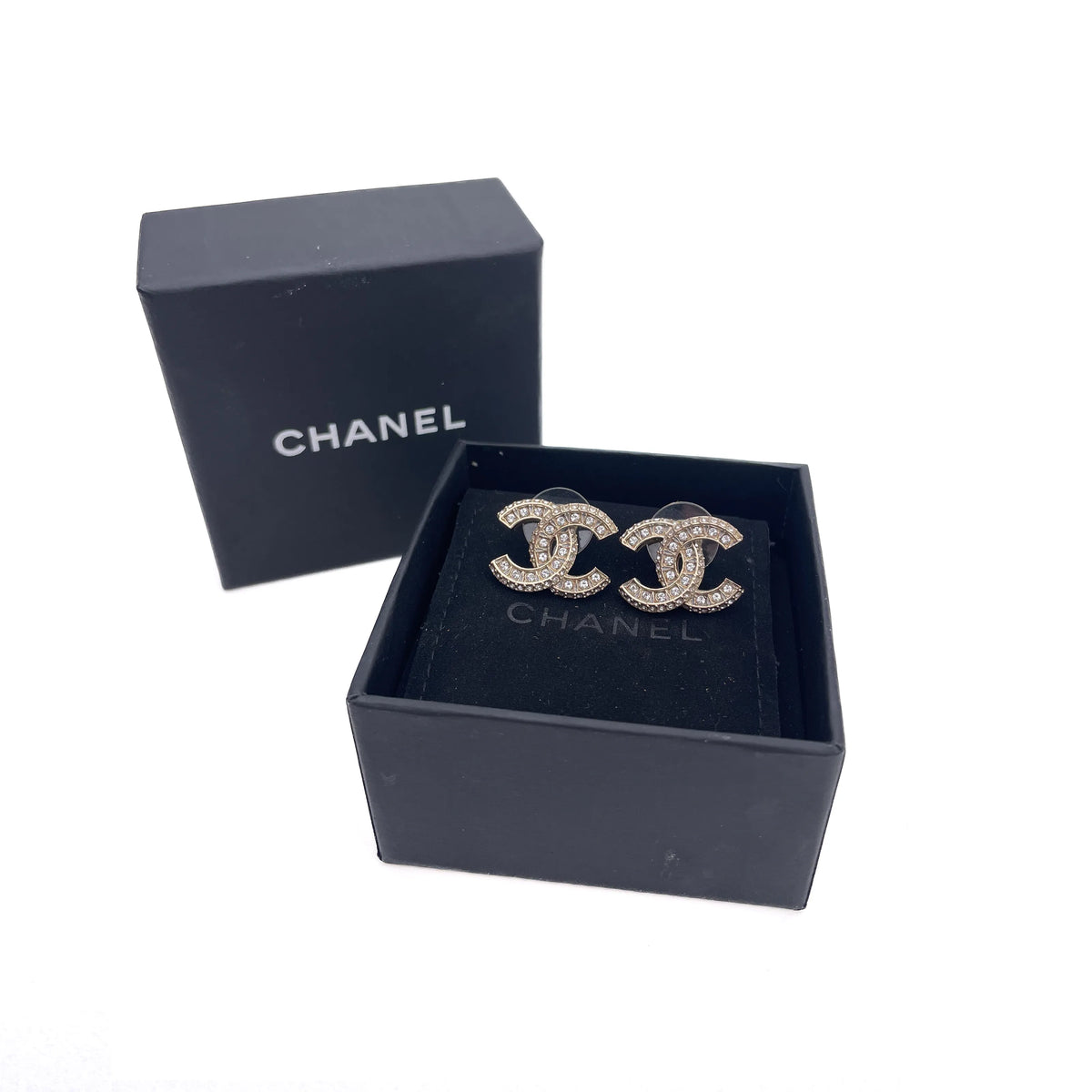 Chanel gold-tone interlocking CC earrings with crystal embellishments, curated Pre-loved Luxury by Myluxe in Helsinki.