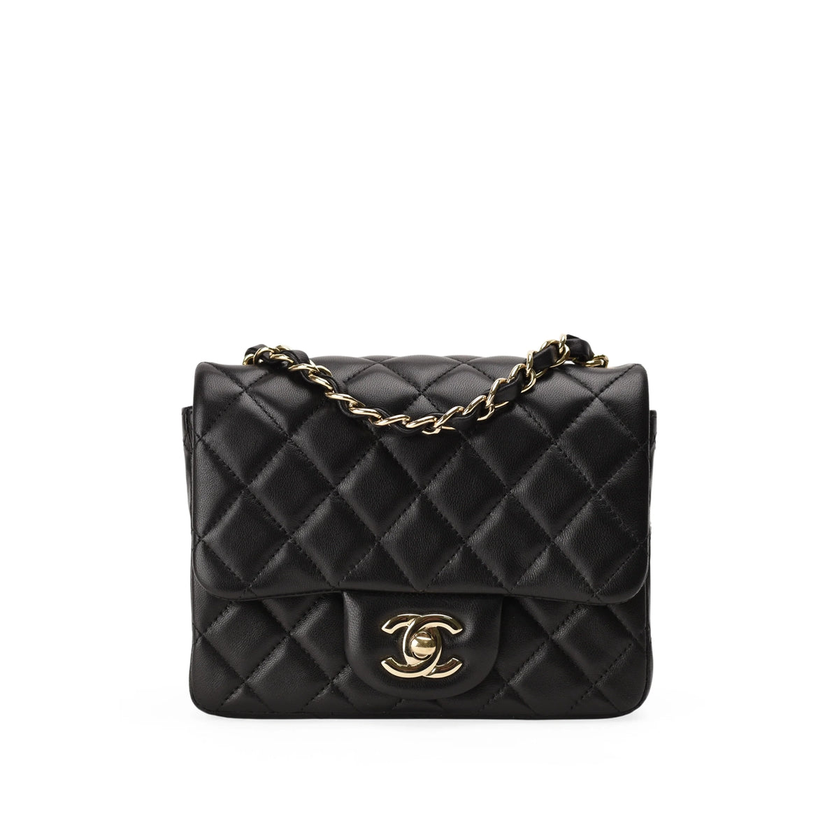 Black quilted leather Chanel handbag with gold chain and CC logo, curated Pre-loved Luxury by Myluxe in Helsinki.