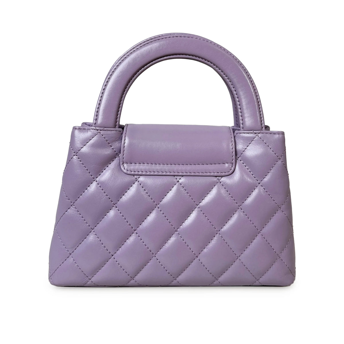 Lavender quilted leather handbag with a top handle, curated Pre-loved Luxury by Myluxe in Helsinki.