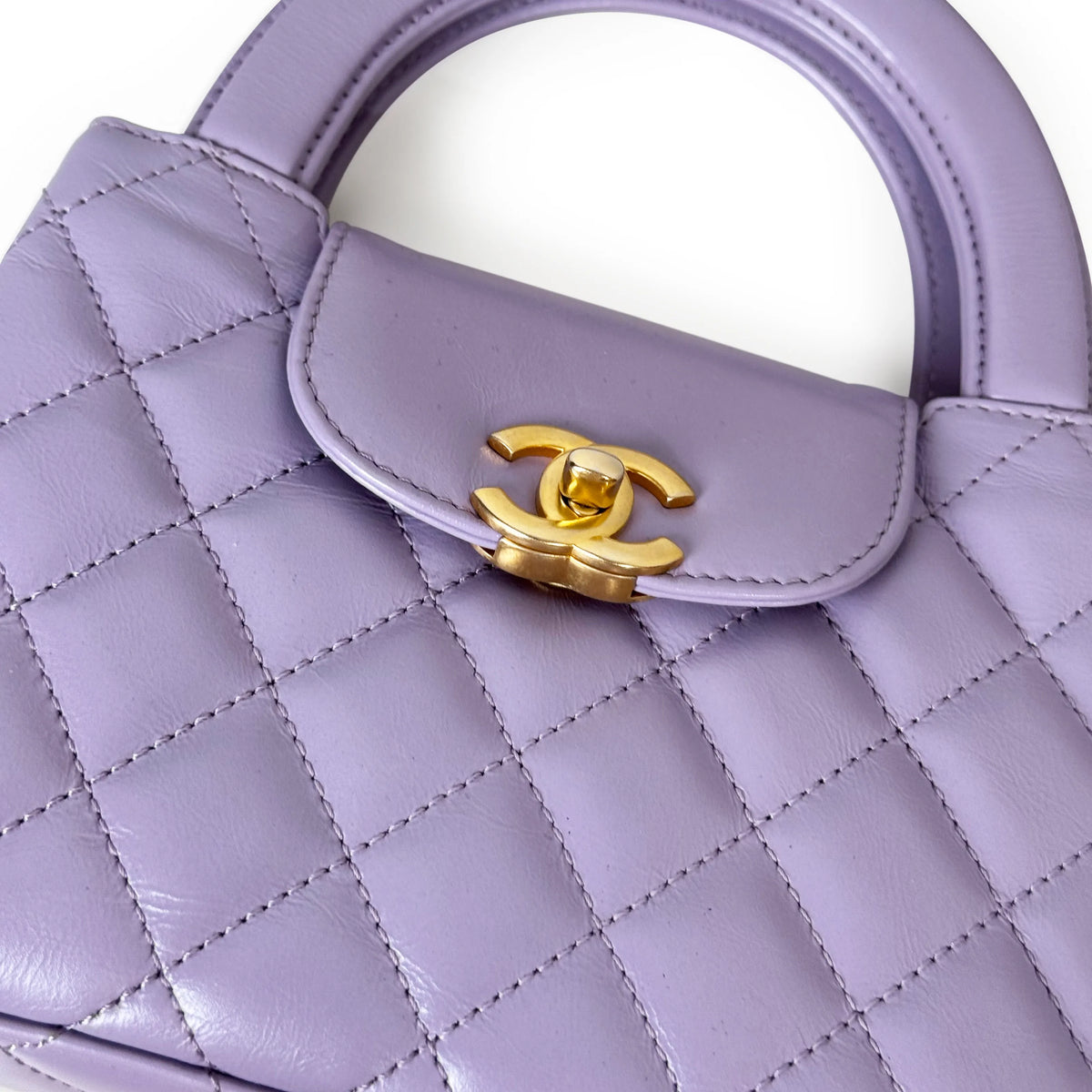 Lavender quilted leather handbag with gold CC clasp, curated Pre-loved Luxury by Myluxe in Helsinki.