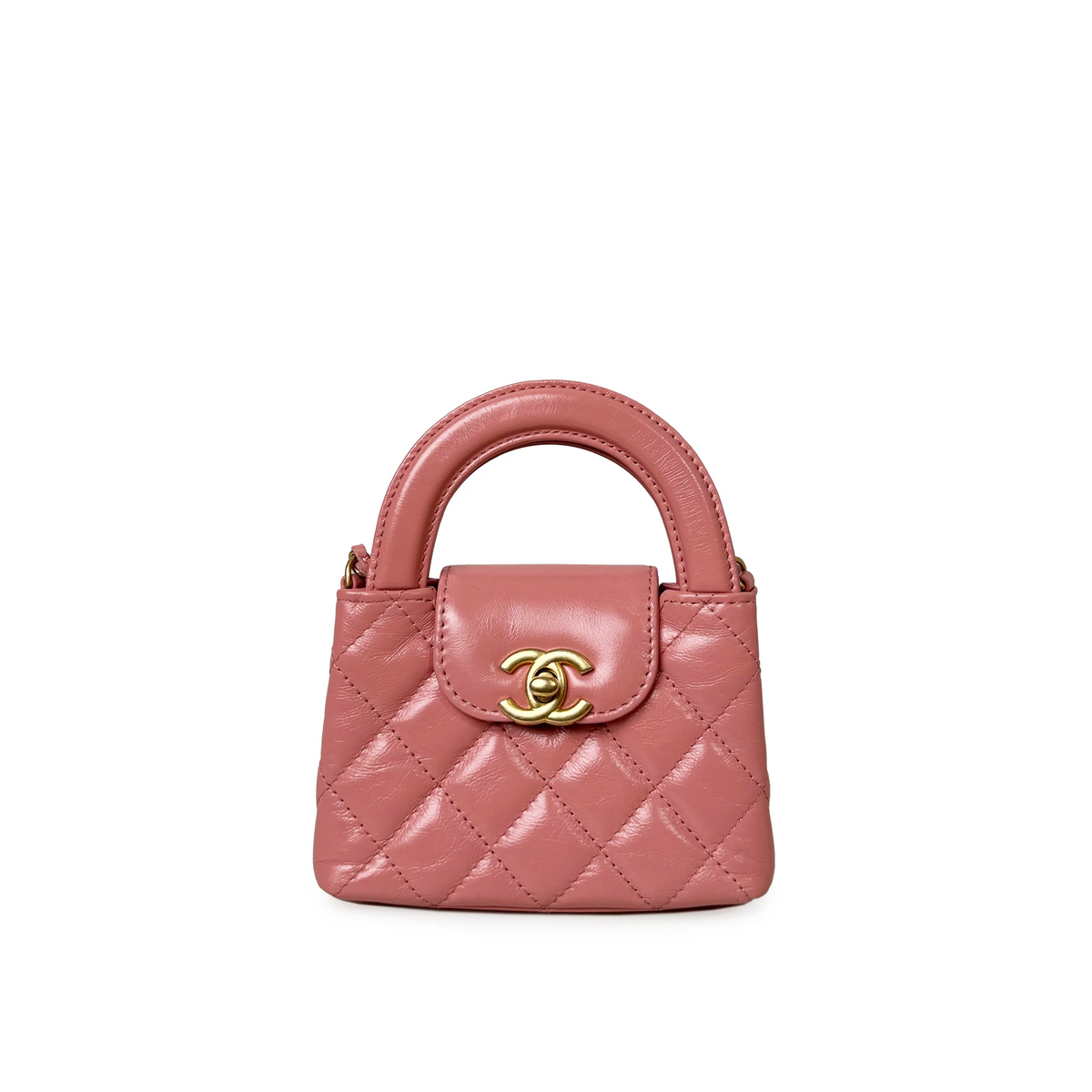 Pink Chanel Nano Kelly bag with gold hardware, showcasing a compact, structured design and elegant top handle.