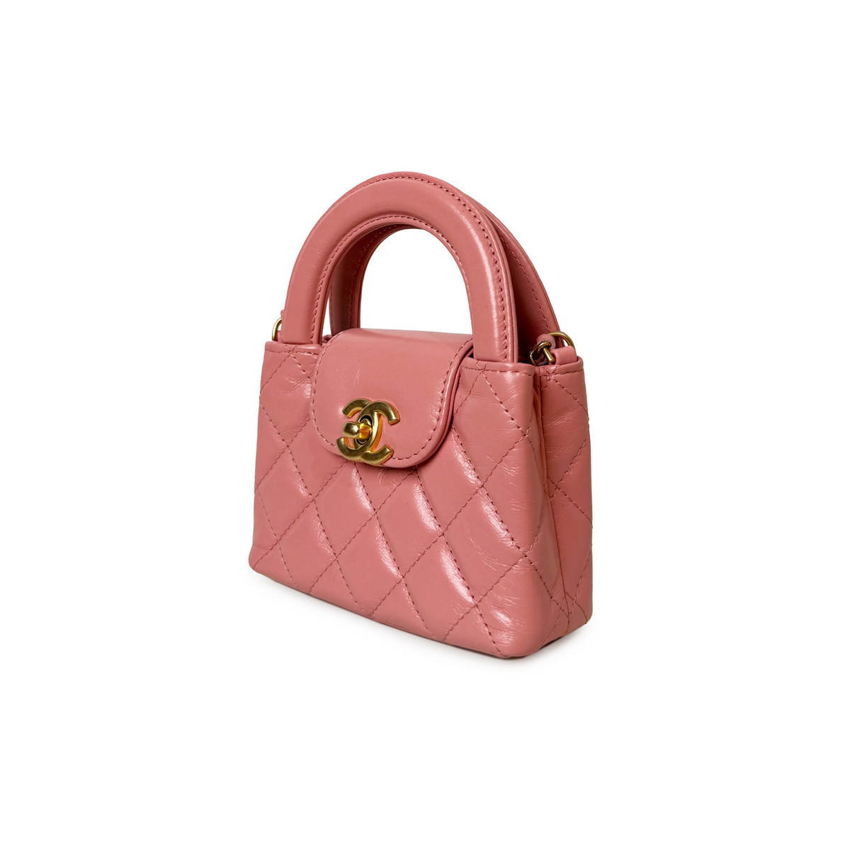 Chanel Pink Nano Kelly Bag featuring a compact design with top handles and signature hardware, perfect for elegant carrying.