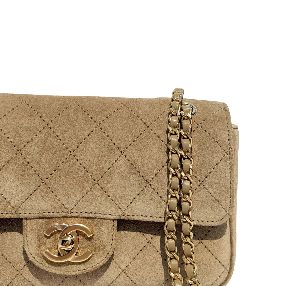 Chanel beige suede quilted flap bag with gold-tone chain strap. curated Pre-loved Luxury by Myluxe in Helsinki.