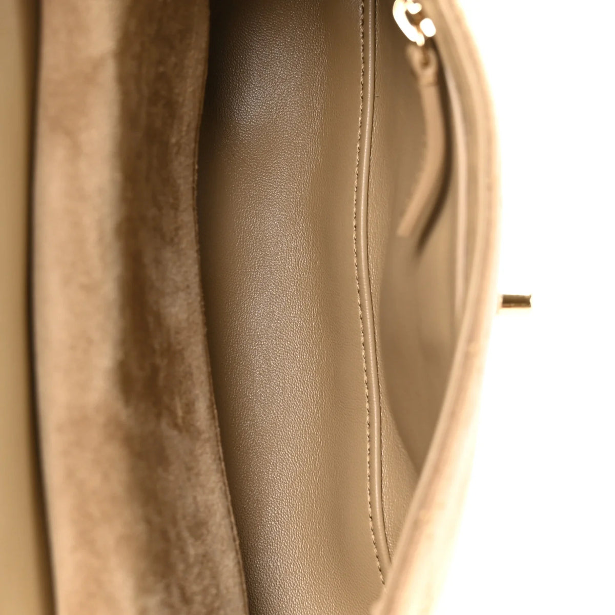 Interior view of a beige suede and leather luxury handbag. curated Pre-loved Luxury by Myluxe in Helsinki.