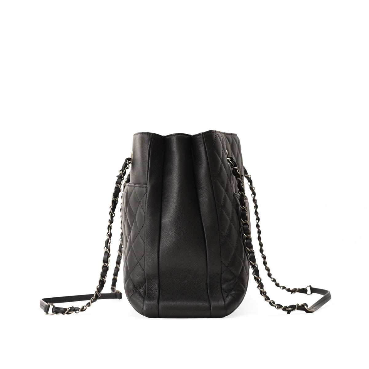 Back view of Chanel Urban Companion black caviar quilted shopping tote with chain straps. curated Pre-loved Luxury by Myluxe in Helsinki.