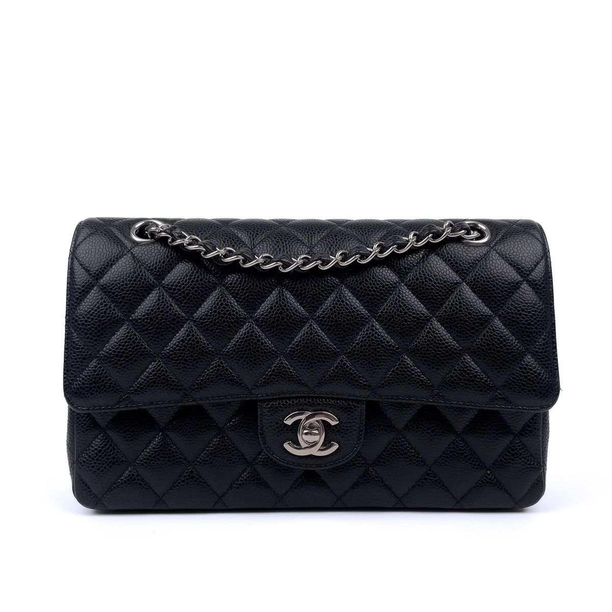 Black quilted caviar leather Chanel flap bag with silver hardware, curated Pre-loved Luxury by Myluxe in Helsinki.