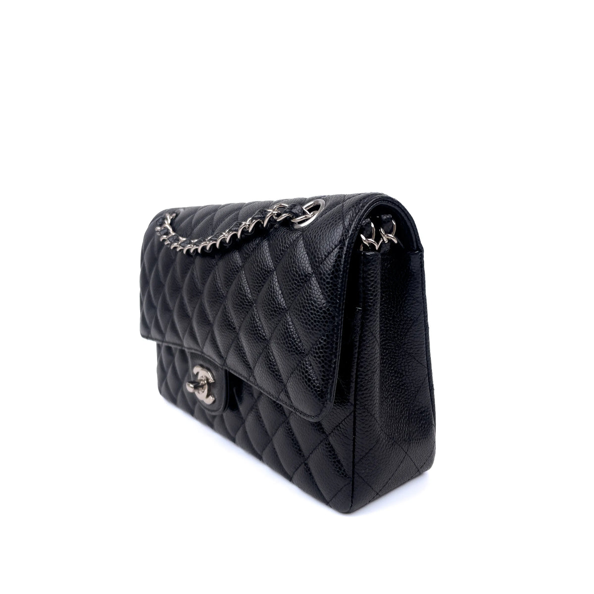Black quilted caviar leather Chanel handbag with silver chain strap, curated Pre-loved Luxury by Myluxe in Helsinki.