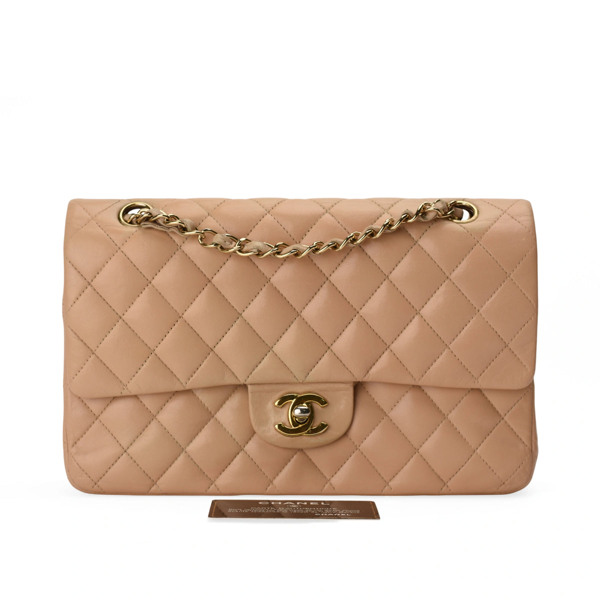 Chanel Timeless medium beige lambskin handbag with gold hardware. curated Pre-loved Luxury by Myluxe in Helsinki.
