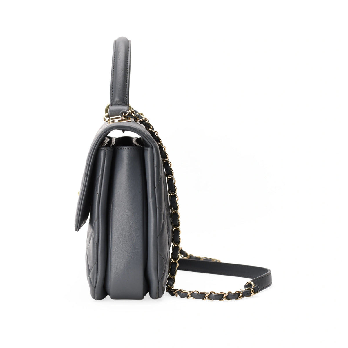 Side view of Chanel Trendy CC Medium Dusty Blue leather handbag with gold chain strap. curated Pre-loved Luxury by Myluxe in Helsinki.