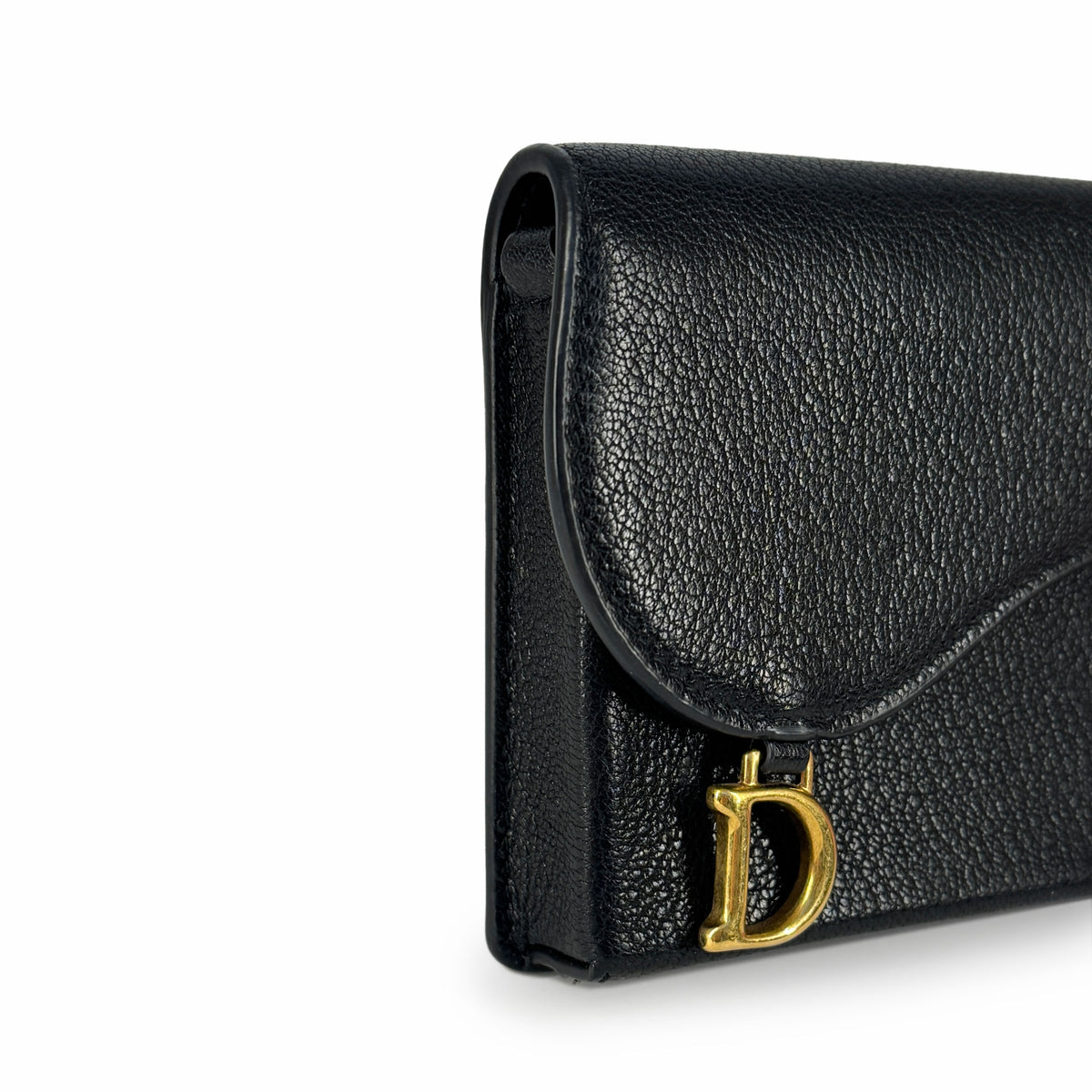 Black grained leather handbag with gold-tone D charm, curated Pre-loved Luxury by Myluxe in Helsinki.