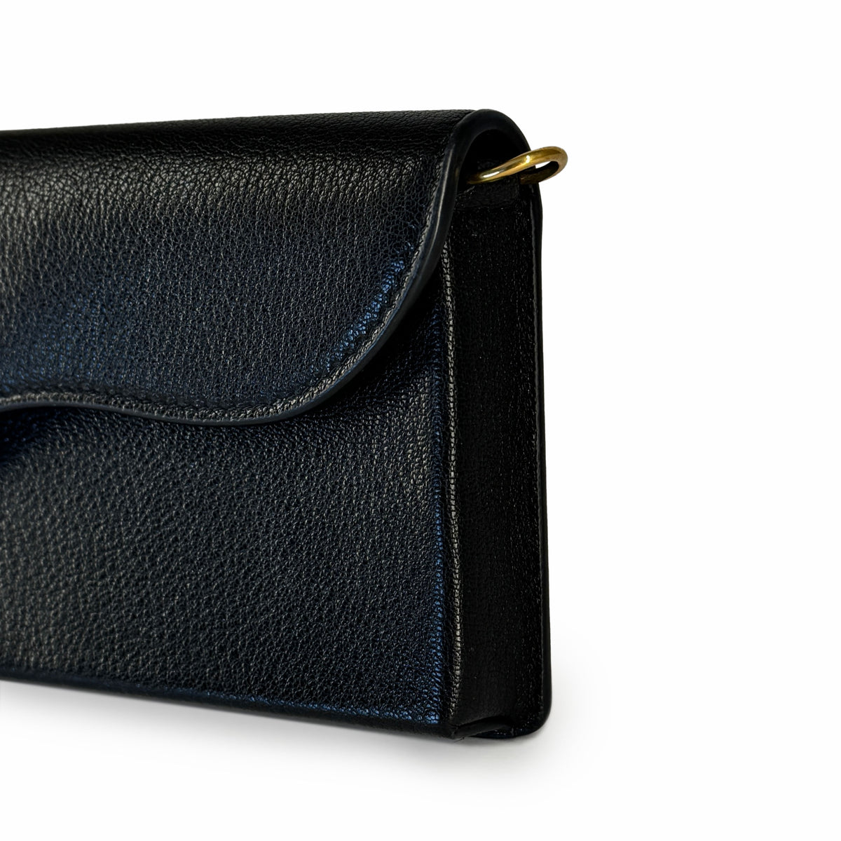 Black grained leather flap crossbody bag with gold hardware, curated Pre-loved Luxury by Myluxe in Helsinki.