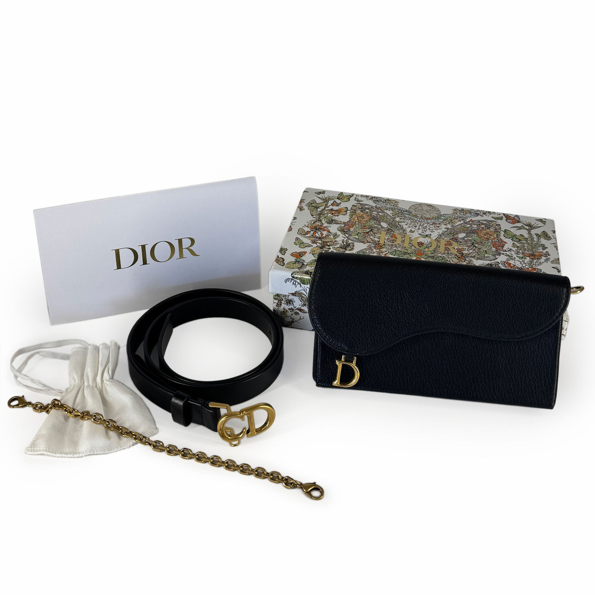 Black grained leather Dior wallet with gold CD logo and matching belt, curated Pre-loved Luxury by Myluxe in Helsinki.