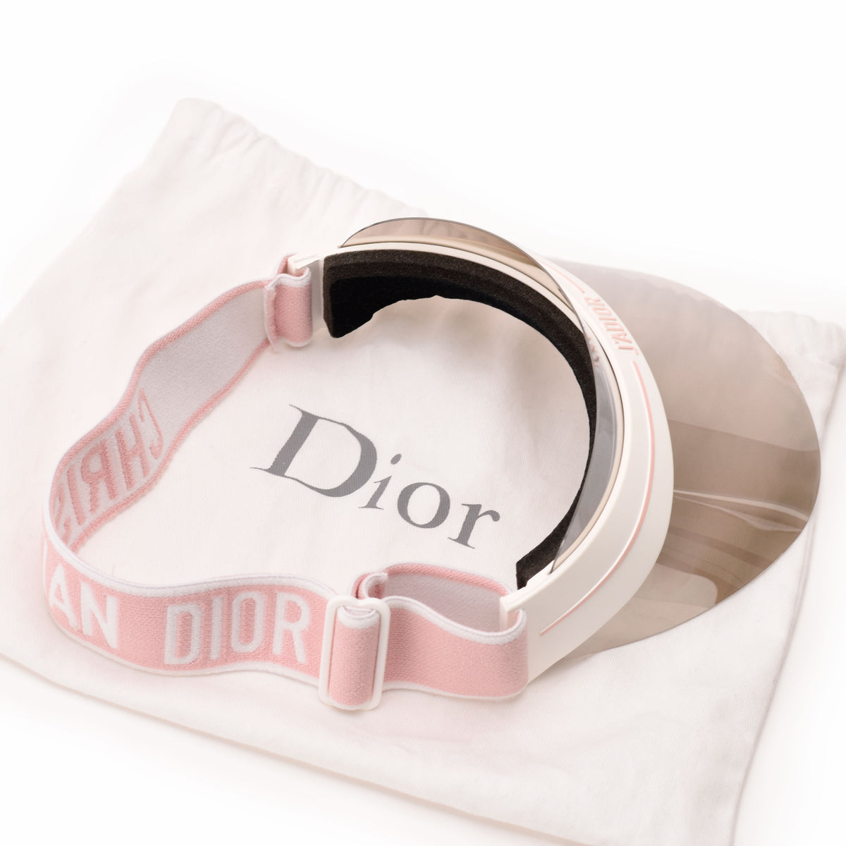 Pink Dior fabric visor with white logo detailing, curated Pre-loved Luxury by Myluxe in Helsinki.