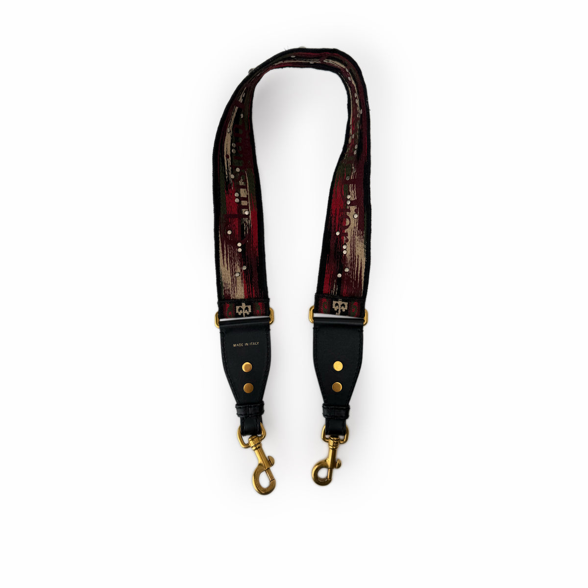 Red and black patterned fabric strap with gold-tone metal hardware, curated Pre-loved Luxury by Myluxe in Helsinki.