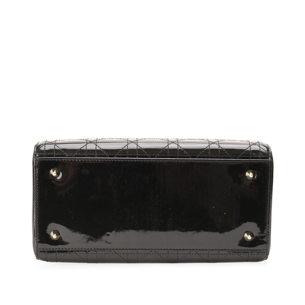 Black patent leather quilted Chanel handbag base with silver-tone metal feet. curated Pre-loved Luxury by Myluxe in Helsinki.